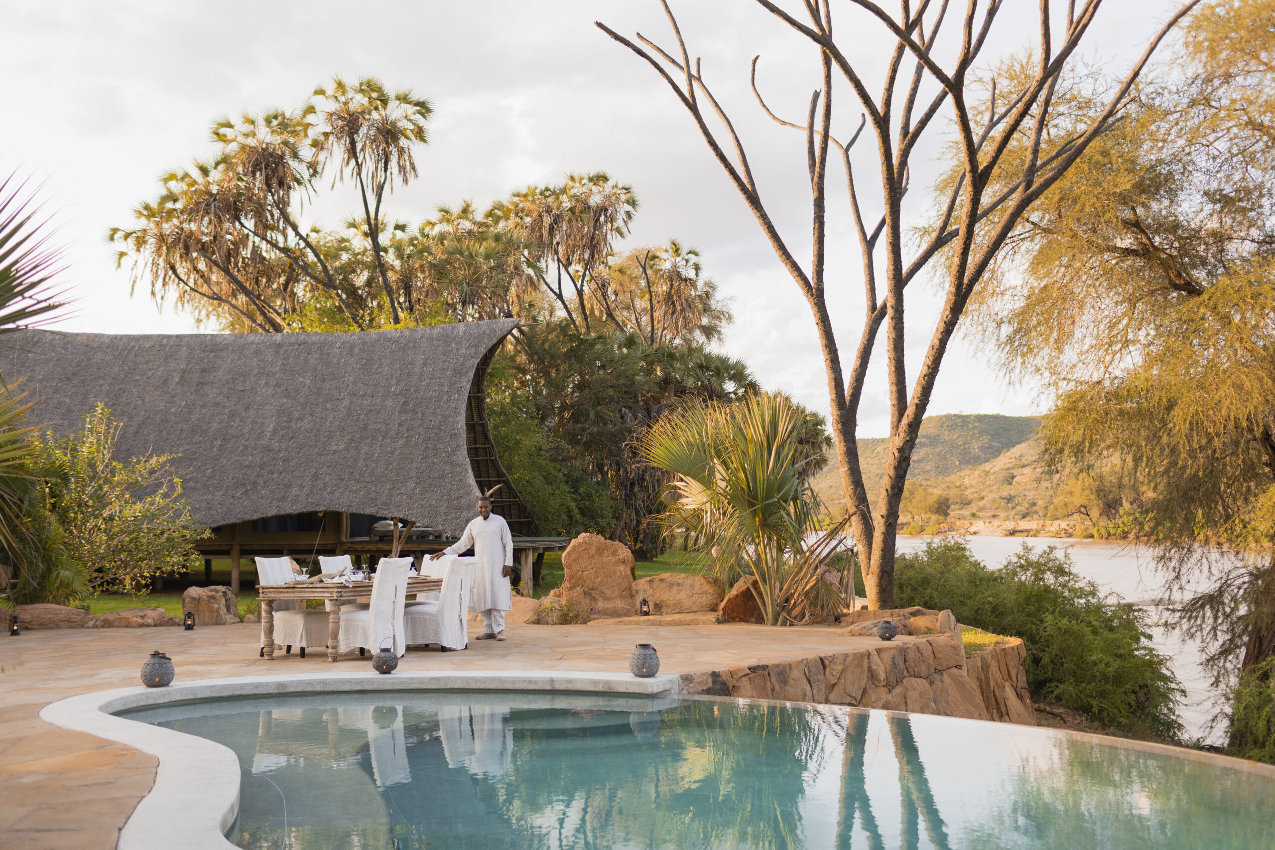 Riverside dining at Galdessa Camp, Tsavo East